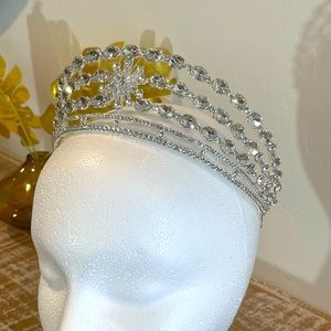 Silver colored tiara. Three tiers of beautiful crystals. New and never worn.